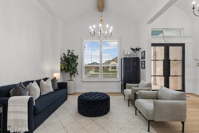 living room featuring high vaulted ceiling, an inviting chandelier, french doors, light hardwood / wood-style flooring, and beam ceiling