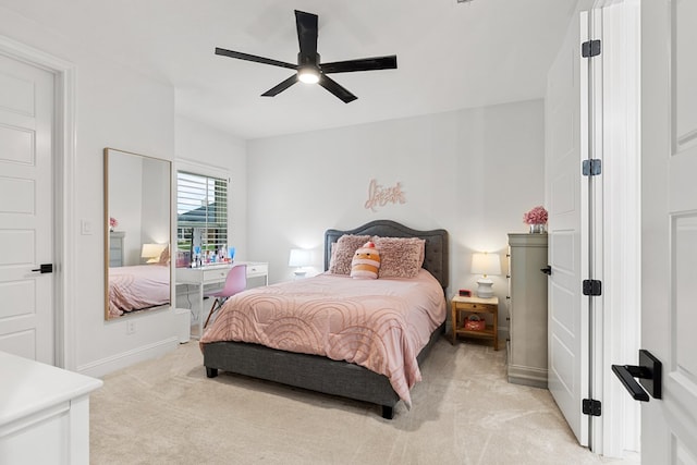 carpeted bedroom featuring ceiling fan