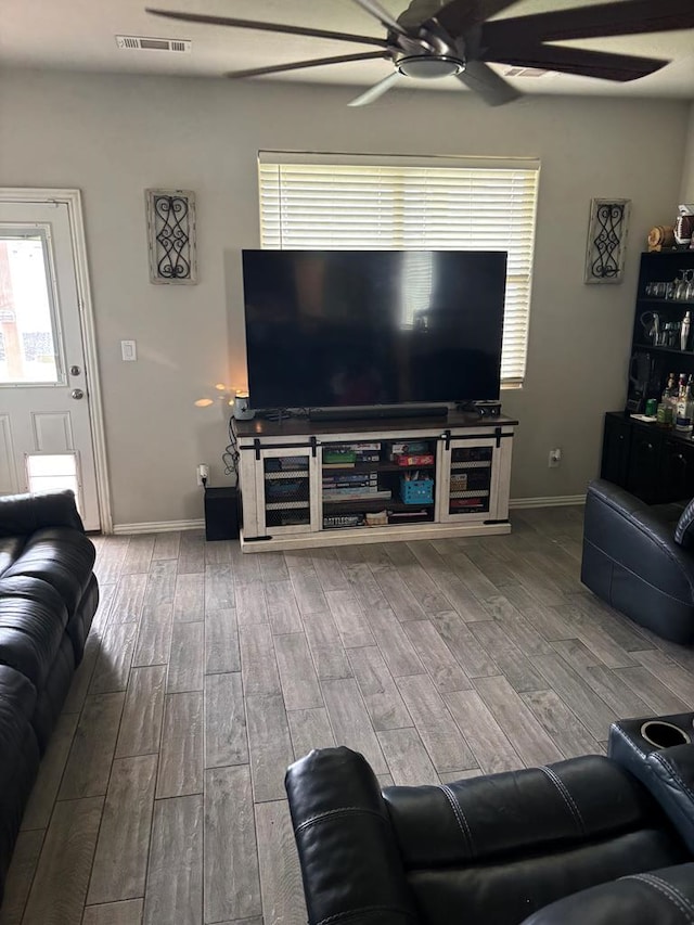 6912 Boss Rnch, Odessa, TX 79765 - living room with a ceiling fan, wood finished floors, and baseboards