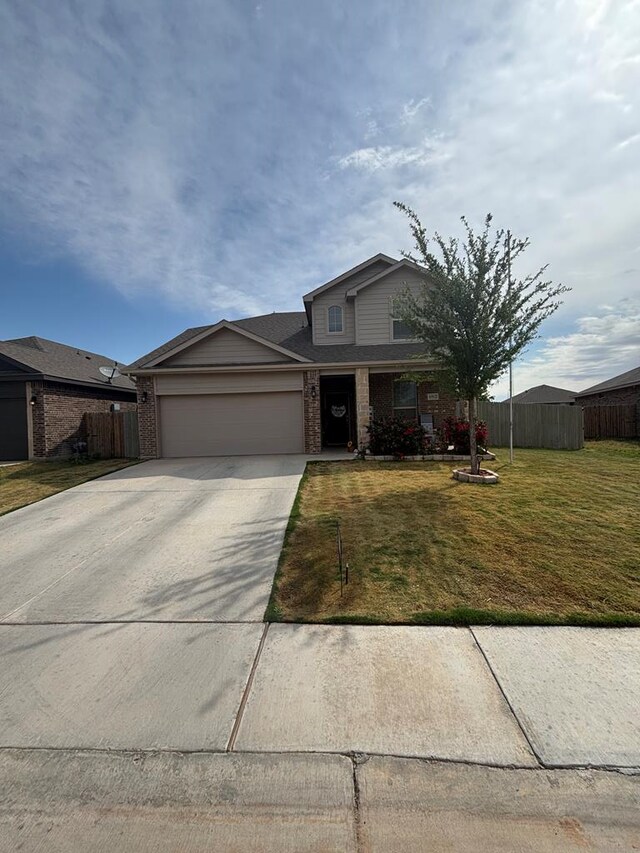 6912 Boss Rnch, Odessa, TX 79765 - traditional-style house featuring a garage, brick siding, and driveway