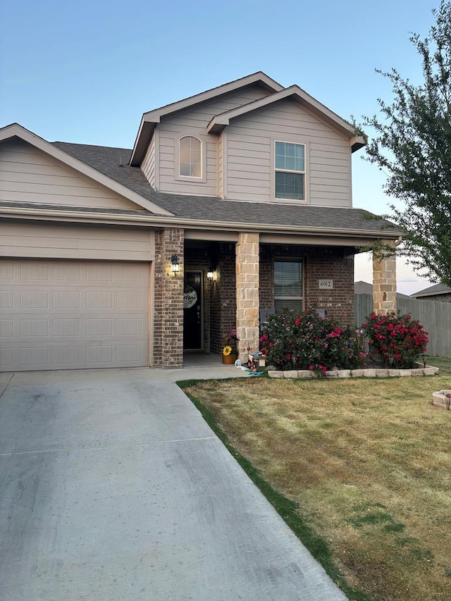 6912 Boss Rnch, Odessa, TX 79765 - traditional home with driveway, brick siding, a garage, and a shingled roof