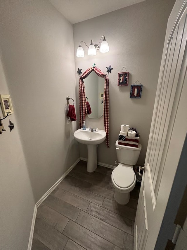 6912 Boss Rnch, Odessa, TX 79765 - bathroom featuring toilet and wood tiled floors