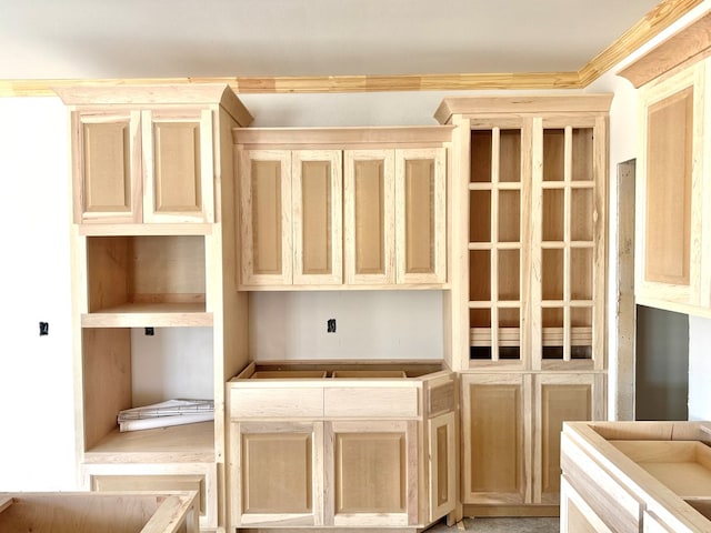 44 La Fauna Dr, Odessa, TX 79765 - kitchen with light brown cabinetry and ornamental molding