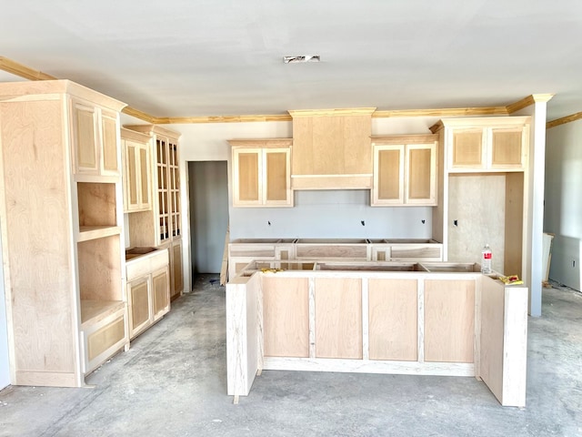 44 La Fauna Dr, Odessa, TX 79765 - kitchen featuring a center island, unfinished concrete floors, light brown cabinetry, and crown molding