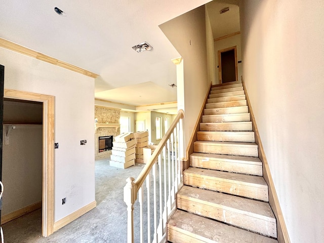 44 La Fauna Dr, Odessa, TX 79765 - stairway featuring carpet flooring, a large fireplace, and baseboards