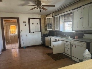 1302 S Texas Ave, Odessa, TX 79761 - kitchen with white dishwasher, a ceiling fan, and dark wood finished floors