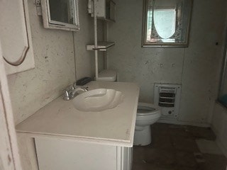 1302 S Texas Ave, Odessa, TX 79761 - bathroom featuring vanity and heating unit