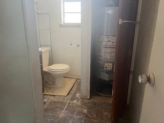 1302 S Texas Ave, Odessa, TX 79761 - bathroom featuring toilet and water heater