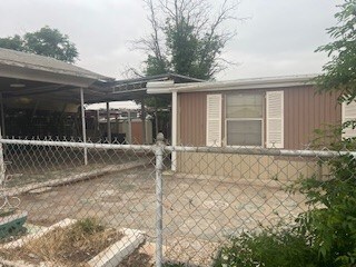 1302 S Texas Ave, Odessa, TX 79761 - view of side of home with board and batten siding
