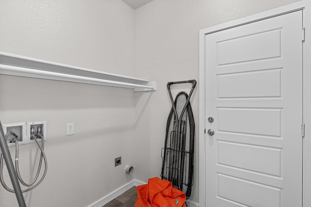 2227 W 3rd St, Odessa, TX 79763 - laundry room with hookup for a washing machine, hookup for an electric dryer, baseboards, and wood finished floors