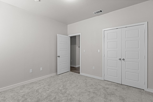 2227 W 3rd St, Odessa, TX 79763 - unfurnished bedroom featuring carpet floors, a closet, and baseboards