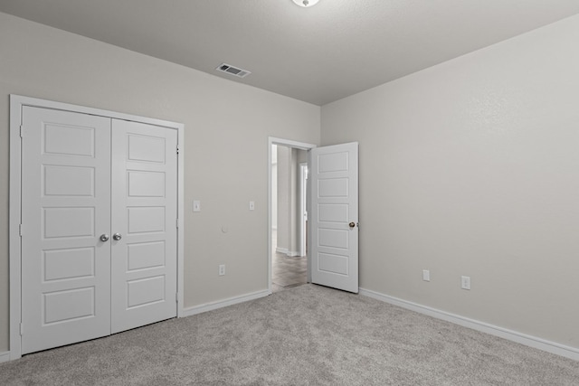 2227 W 3rd St, Odessa, TX 79763 - unfurnished bedroom with carpet, baseboards, and a closet