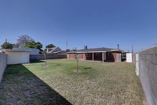 1500 S Bruce Ave, Monahans, TX 79756 - fenced backyard featuring a patio area and a storage shed