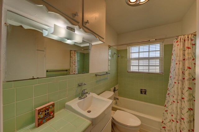 1500 S Bruce Ave, Monahans, TX 79756 - bathroom with shower / bathtub combination with curtain, vanity, and tile walls
