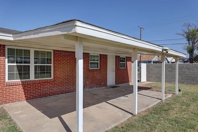 1500 S Bruce Ave, Monahans, TX 79756 - view of patio featuring an attached carport
