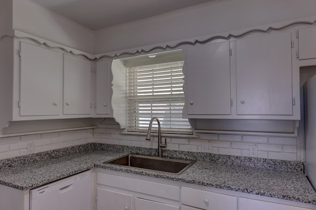 1500 S Bruce Ave, Monahans, TX 79756 - kitchen featuring dishwasher, tasteful backsplash, white cabinets, and crown molding
