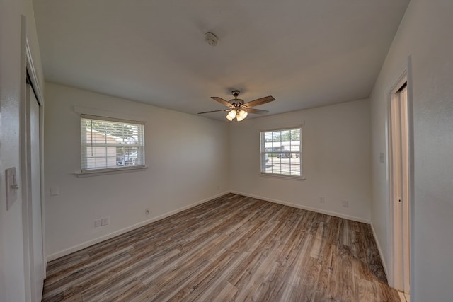1500 S Bruce Ave, Monahans, TX 79756 - unfurnished bedroom featuring wood finished floors, a closet, and ceiling fan