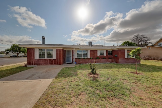 1500 S Bruce Ave, Monahans, TX 79756 - single story home with brick siding, driveway, and a front yard