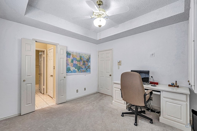 6415 San Mateo Ln, Odessa, TX 79762 - office featuring a raised ceiling, a ceiling fan, light carpet, and a textured ceiling