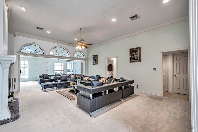 6415 San Mateo Ln, Odessa, TX 79762 - living area featuring light colored carpet, crown molding, decorative columns, ceiling fan, and recessed lighting