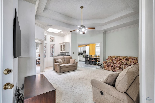 6415 San Mateo Ln, Odessa, TX 79762 - living area with a raised ceiling, ceiling fan, carpet, and crown molding