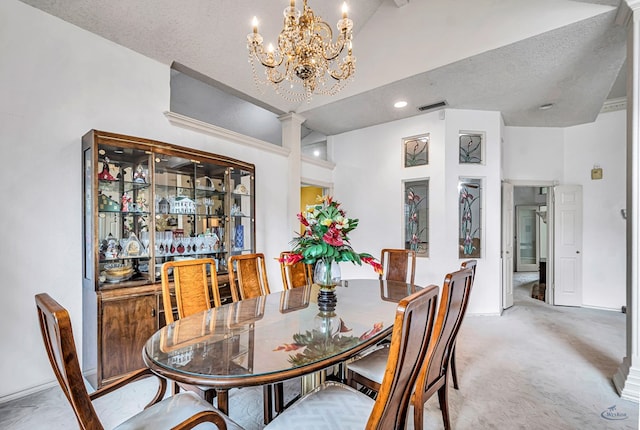 6415 San Mateo Ln, Odessa, TX 79762 - dining room featuring decorative columns, a chandelier, and light colored carpet