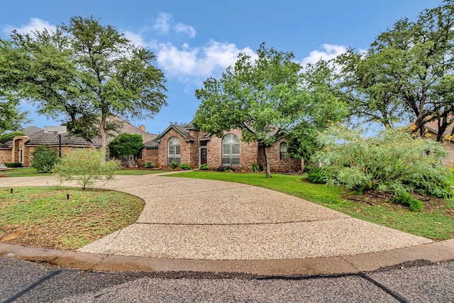 6415 San Mateo Ln, Odessa, TX 79762 - view of front of property featuring brick siding and a front lawn
