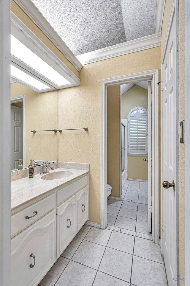 6415 San Mateo Ln, Odessa, TX 79762 - bathroom featuring vanity, ornamental molding, an enclosed shower, tile patterned flooring, and a textured ceiling