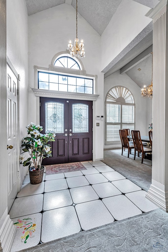 6415 San Mateo Ln, Odessa, TX 79762 - foyer featuring a chandelier, high vaulted ceiling, and carpet