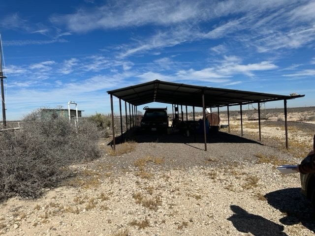 exterior space with a carport