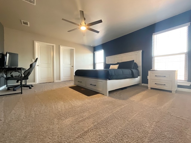 1311 Red Cliff Ave, Odessa, TX 79765 - bedroom with light colored carpet, ceiling fan, and an office area