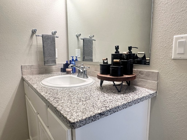 1311 Red Cliff Ave, Odessa, TX 79765 - bathroom featuring vanity and a textured wall