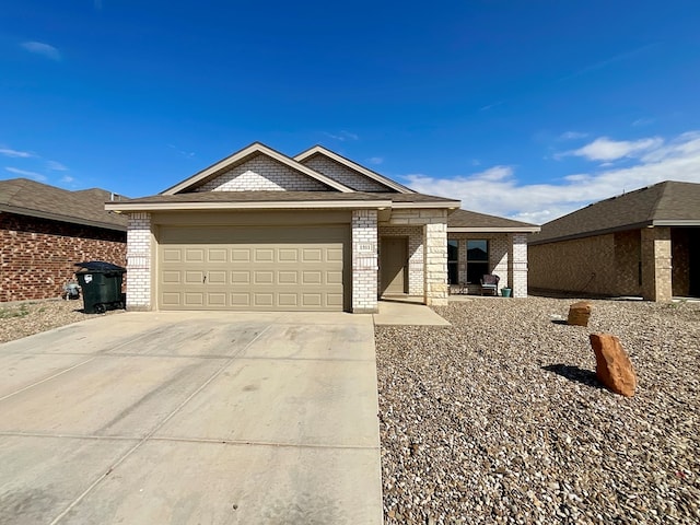 1311 Red Cliff Ave, Odessa, TX 79765 - ranch-style house featuring brick siding, driveway, and an attached garage