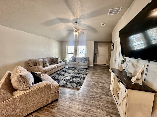 1311 Red Cliff Ave, Odessa, TX 79765 - living area with a ceiling fan, dark wood-type flooring, and lofted ceiling