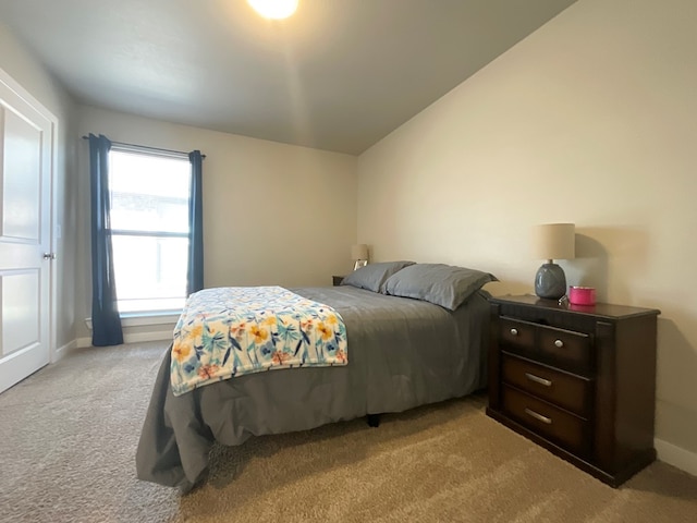 1311 Red Cliff Ave, Odessa, TX 79765 - bedroom featuring carpet and vaulted ceiling