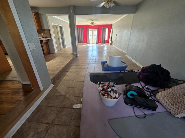 3613 Locust Ave, Odessa, TX 79762 - hallway with dark tile patterned flooring and a textured wall