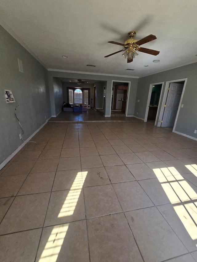 3613 Locust Ave, Odessa, TX 79762 - unfurnished living room with crown molding, a ceiling fan, and tile patterned flooring
