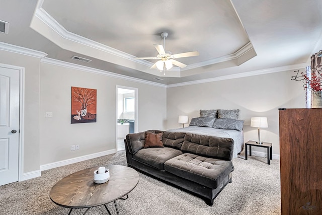 811 E 97th Ct, Odessa, TX 79765 - carpeted bedroom with a tray ceiling, crown molding, baseboards, connected bathroom, and a ceiling fan