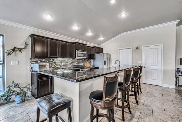 811 E 97th Ct, Odessa, TX 79765 - kitchen with appliances with stainless steel finishes, ornamental molding, a kitchen breakfast bar, baseboards, and decorative backsplash