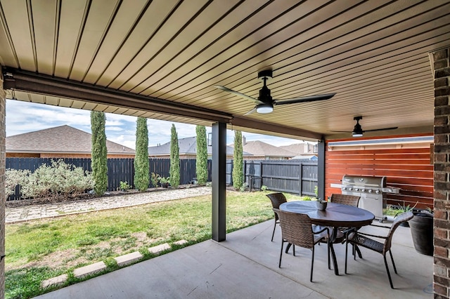 811 E 97th Ct, Odessa, TX 79765 - view of patio featuring area for grilling, ceiling fan, and outdoor dining area