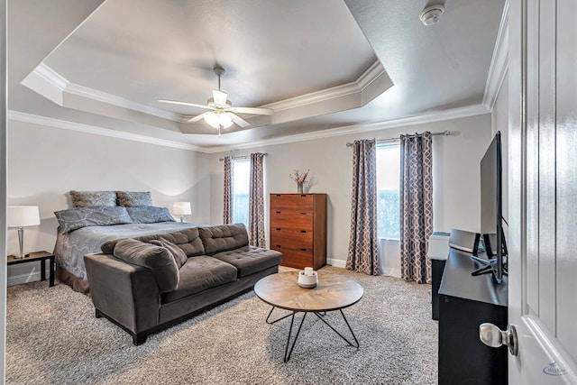 811 E 97th Ct, Odessa, TX 79765 - bedroom with a tray ceiling, carpet, crown molding, and baseboards