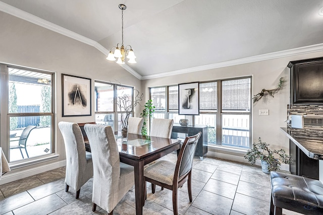 811 E 97th Ct, Odessa, TX 79765 - dining room featuring a chandelier, healthy amount of natural light, vaulted ceiling, crown molding, and baseboards