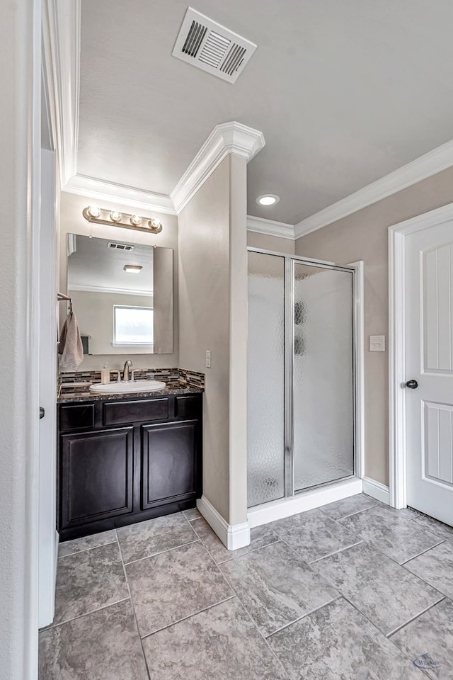 811 E 97th Ct, Odessa, TX 79765 - bathroom with ornamental molding, a stall shower, vanity, baseboards, and tile patterned flooring