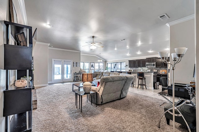 811 E 97th Ct, Odessa, TX 79765 - living area featuring crown molding, ceiling fan, light carpet, and baseboards