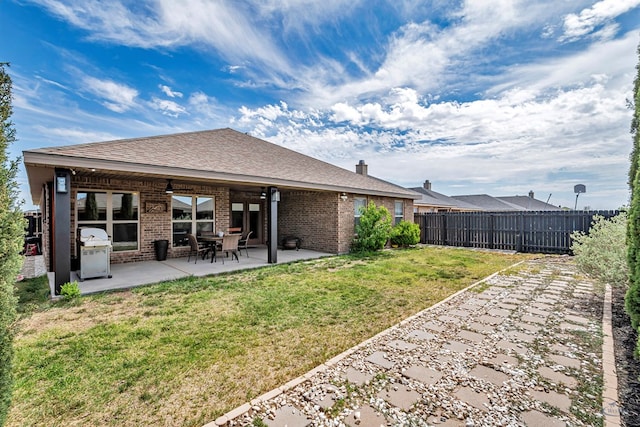 811 E 97th Ct, Odessa, TX 79765 - rear view of property featuring brick siding, a patio, and a ceiling fan