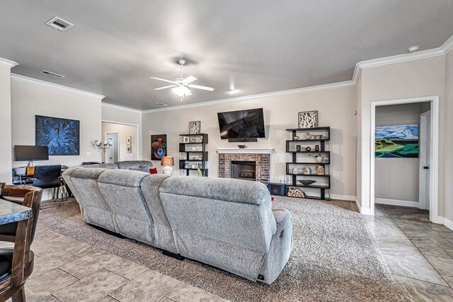 811 E 97th Ct, Odessa, TX 79765 - living room featuring crown molding, a ceiling fan, a fireplace, and baseboards