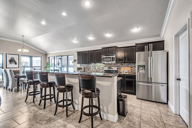 811 E 97th Ct, Odessa, TX 79765 - kitchen featuring stainless steel appliances, ornamental molding, a kitchen bar, an island with sink, and lofted ceiling
