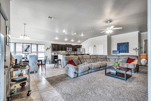 811 E 97th Ct, Odessa, TX 79765 - living area with ornamental molding, lofted ceiling, ceiling fan, a chandelier, and light tile patterned floors