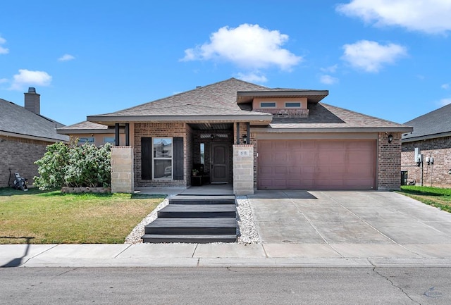 811 E 97th Ct, Odessa, TX 79765 - view of front facade featuring brick siding, a garage, a front yard, and driveway