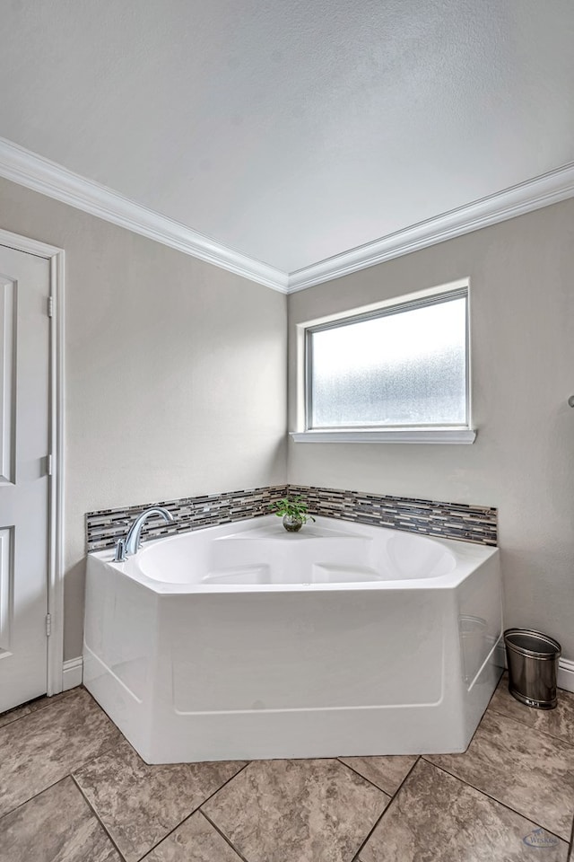 811 E 97th Ct, Odessa, TX 79765 - full bath featuring ornamental molding, a bath, and baseboards